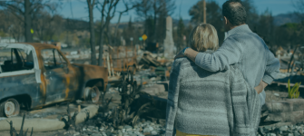 Couple observes their home destroyed by Hurricane Helene, representing the devastation of the natural disaster and the IRS tax relief available for affected Florida taxpayers