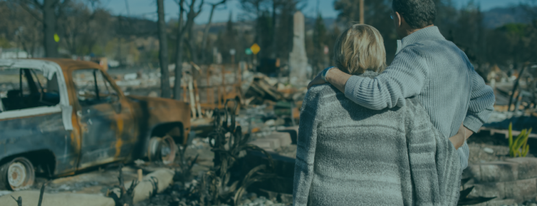 Couple observes their home destroyed by Hurricane Helene, representing the devastation of the natural disaster and the IRS tax relief available for affected Florida taxpayers